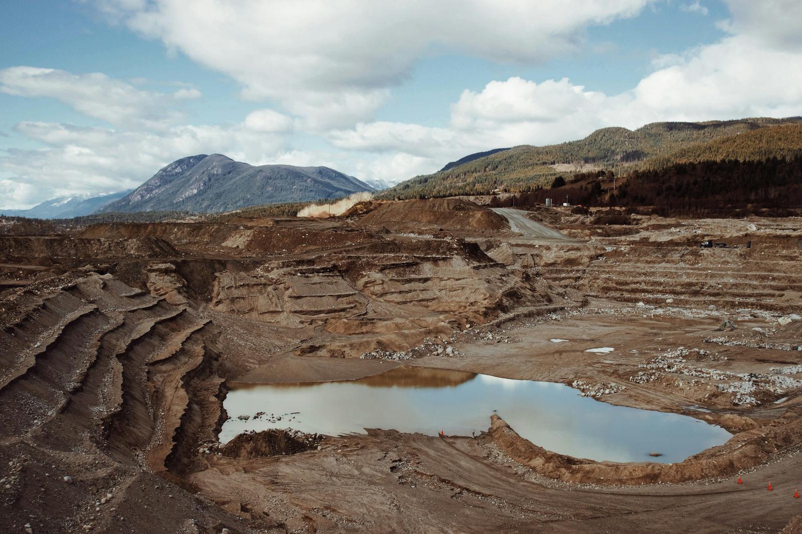 Open-pit mine with a pond at the bottom